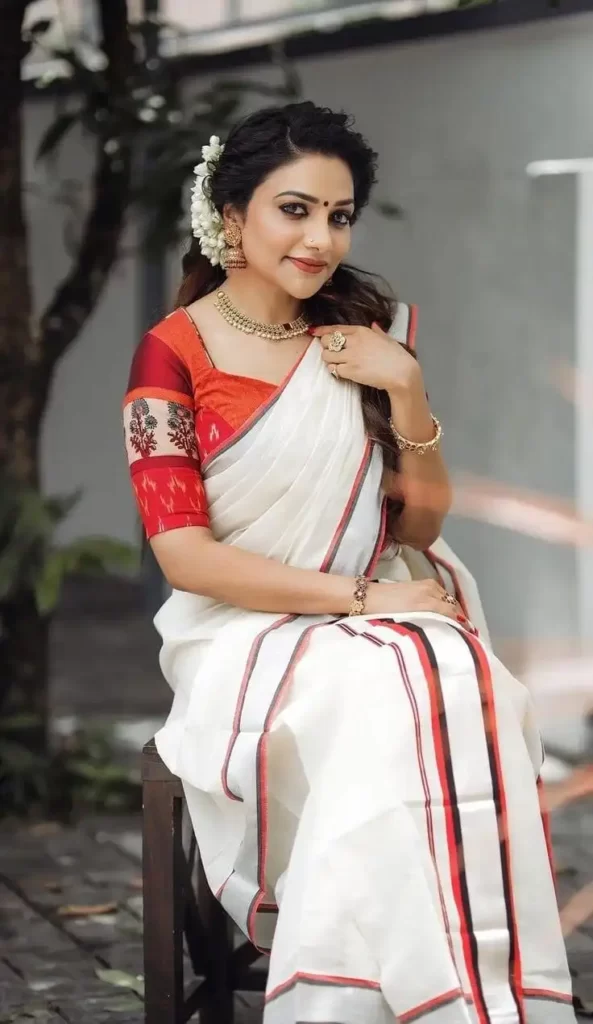 Kerala off-white with green and red semi tissue handwoven and hand painted  mural designed half saree